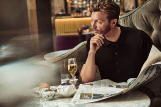 Man eating at Palmen restaurant, Grand Hotel Oslo by Scandic in Norway