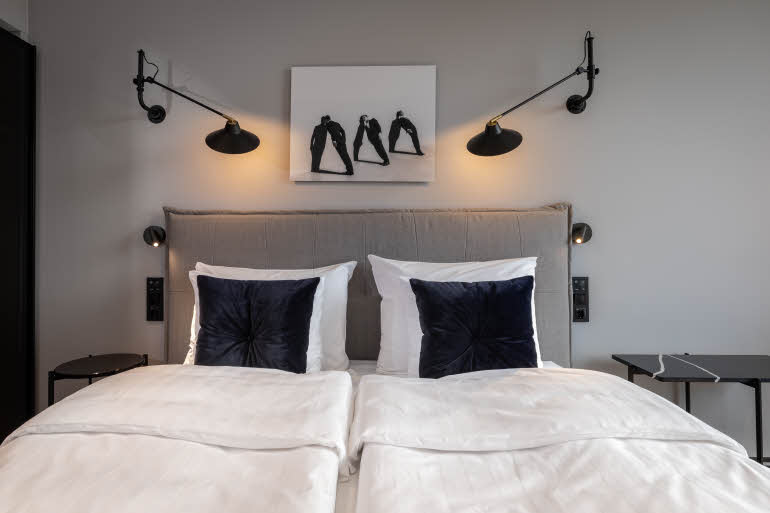 bed in standard room at scandic grand central helsinki