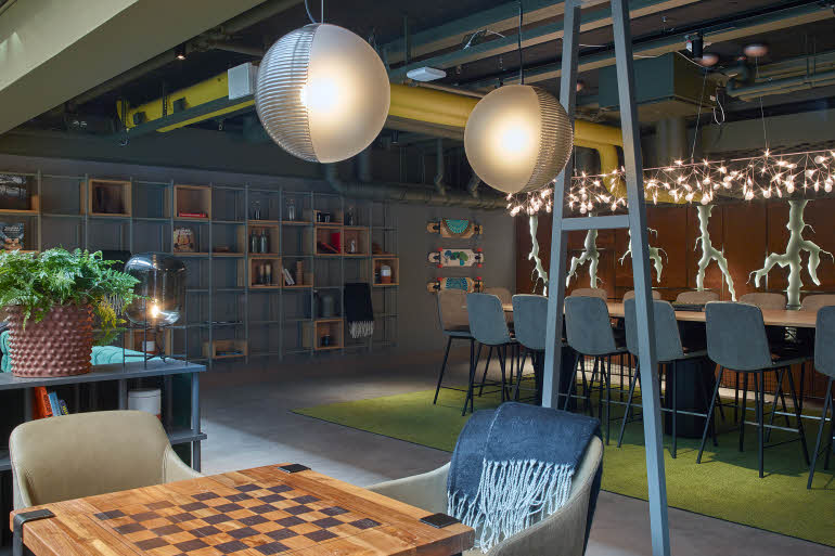 Seating area in cafe at Downtown Camper by Scandic