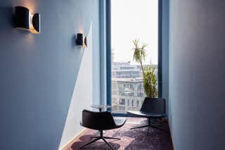 Chairs by a window in the Conference hallway 
